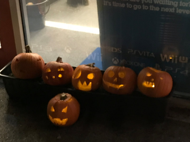 image shows carved pumpkins  outside of House in the Basement Youth Cafe.
