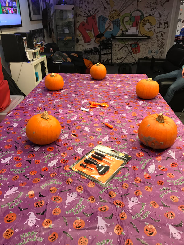 image shows carved pumpkins on the table at House in the Basement Youth Cafe.