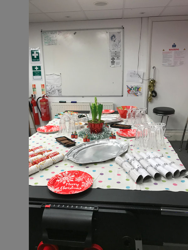 image shows a table set up for the 2017 Christmas dinner at House in Basement Youth Cafe.
