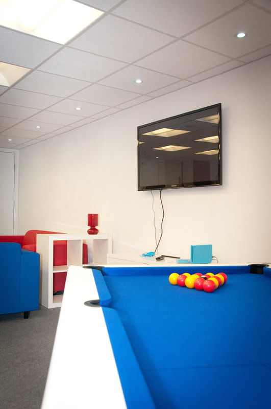 image showing the TV and pool table inside House in the Basement Youth Cafe when it first opened.
