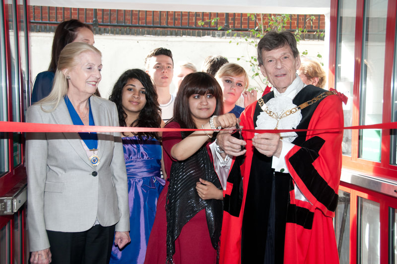image of The Mayor of Sevenoaks, Cllr Richard Parry along with a group of young people opening House in the Basement Youth Cafe